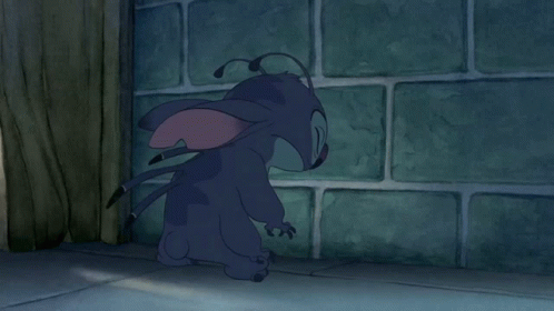 A Cartoon Character Is Standing In Front Of A Wall GIF