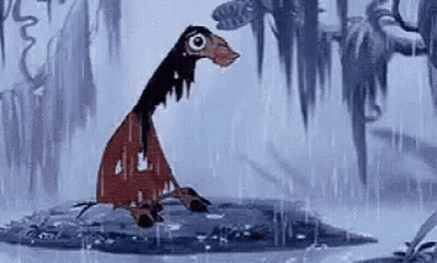 A Cartoon Character Is Standing In The Rain . GIF