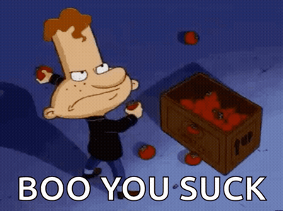 A Cartoon Character Is Standing Next To A Box Of Tomatoes With The Words Boo You Suck Below Him GIF