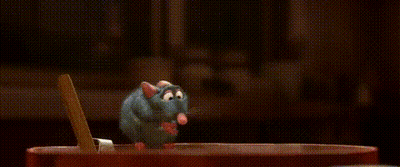 A Cartoon Character Is Standing Next To A Cartoon Character In A Kitchen . GIF