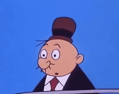A Cartoon Character Is Wearing A Suit And Tie And Has Two Faces . GIF
