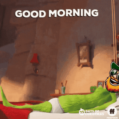 A Cartoon Character Laying On A Bed With The Words " Good Morning " GIF