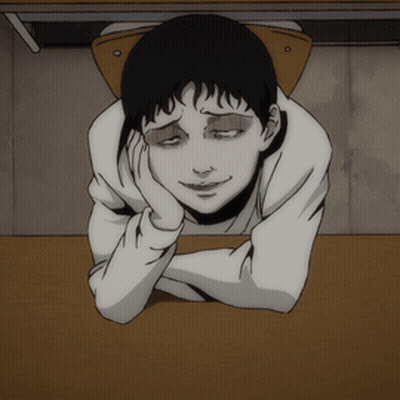 A Cartoon Character Laying On A Table With His Head On His Hand GIF