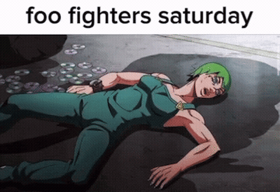 A Cartoon Character Laying On The Ground With The Words " Foo Fighters Saturday " GIF