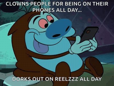 A Cartoon Character Looking At A Cell Phone With A Caption That Says Clowns People For Being On Their Phones All Day ... GIF