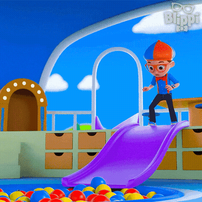 A Cartoon Character Named Blippi Is Playing On A Slide In A Pool Of Balls GIF