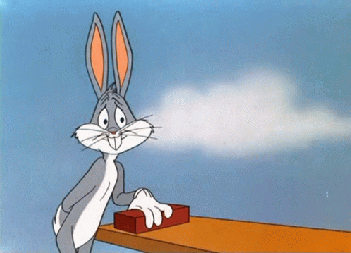 A Cartoon Character Named Bugs Bunny Is Pressing A Button GIF