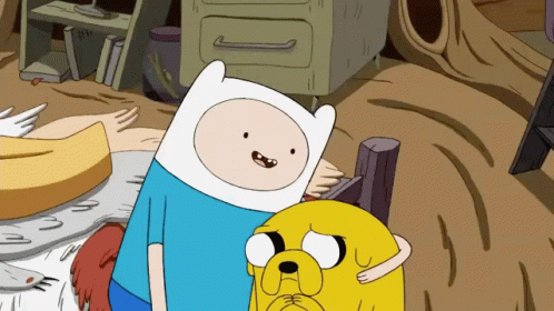 A Cartoon Character Named Finn Is Standing Next To A Yellow Dog Named Jake GIF