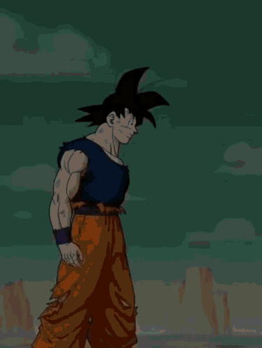 A Cartoon Character Named Goku From Dragon Ball Is Standing In Front Of A Mountain GIF