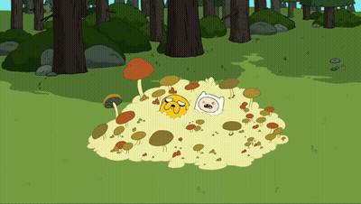 A Cartoon Character Named Jake And Finn Are Laying In A Pile Of Mushrooms GIF