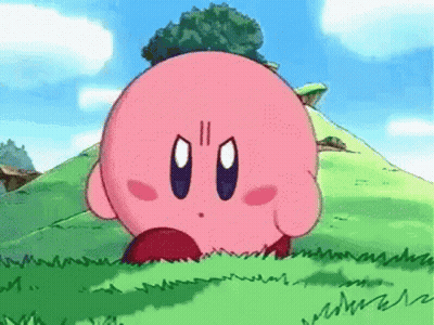 A Cartoon Character Named Kirby Is Standing In The Grass On A Hill . GIF
