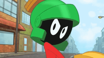 A Cartoon Character Named Marvin The Martian Is Standing In Front Of A Building GIF