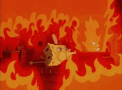 A Cartoon Character Named Spongebob Is Standing In A Room Filled With Flames . GIF