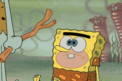 A Cartoon Character Named Spongebob Is Standing Next To A Rock GIF