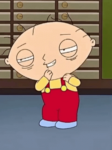 A Cartoon Character Named Stewie From Family Guy Is Standing In Front Of A Wall Of Drawers And Smiling . GIF
