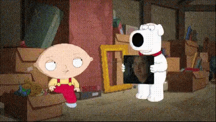 A Cartoon Character Named Stewie Holding A Picture Of Brian GIF