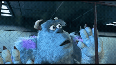 A Cartoon Character Named Sulley Is Behind A Fence GIF