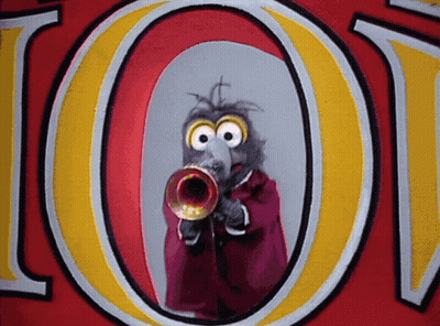 A Cartoon Character Playing A Trumpet In Front Of A Large Letter O GIF