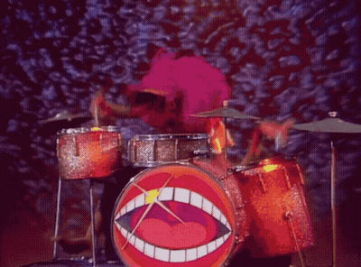 A Cartoon Character Playing Drums With A Big Mouth On The Drum GIF