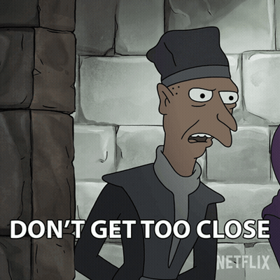 A Cartoon Character Says " Do N't Get Too Close " In Front Of A Brick Wall GIF