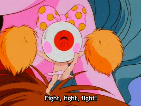 A Cartoon Character Says Fight Fight Fight In Front Of A Big Pink Object GIF
