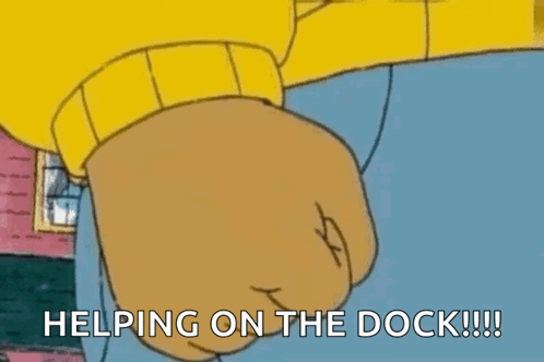 A Cartoon Character Says Helping On The Dock With His Fist In The Air GIF