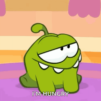 A Cartoon Character Says I 'M Hungry While Sitting On The Floor . GIF