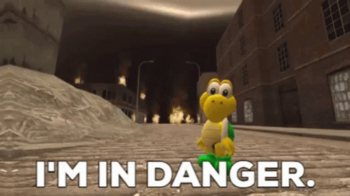 A Cartoon Character Says I 'M In Danger In Front Of A Burning Building GIF