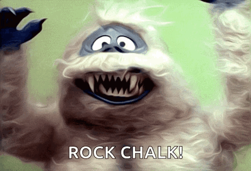 A Cartoon Character Says Rock Chalk In Front Of Him GIF