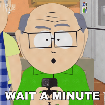 A Cartoon Character Says Wait A Minute While Holding A Phone GIF