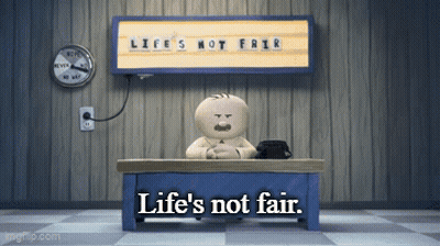 A Cartoon Character Sits At A Desk Under A Sign That Says Life 'S Not Friar GIF