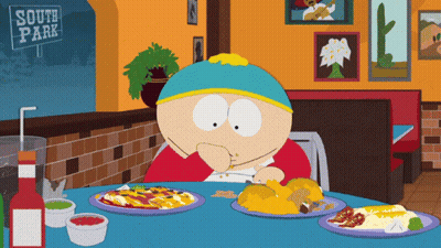 A Cartoon Character Sits At A Table With Plates Of Food And A Sign That Says South Park GIF