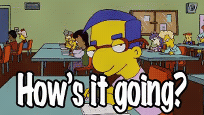 A Cartoon Character Sitting At A Desk With The Words How 'S It Going Written Below Him GIF