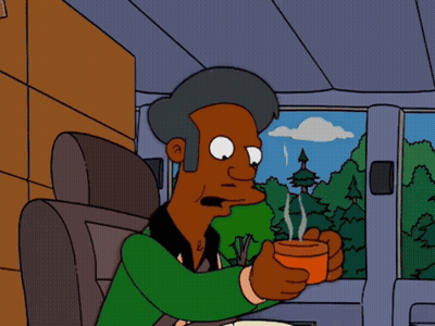 A Cartoon Character Sitting In A Car Holding A Cup GIF