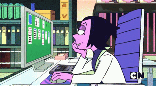 A Cartoon Character Sitting In Front Of A Computer With Cn Written On The Bottom Of The Screen GIF