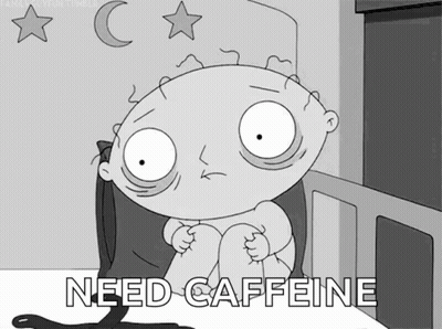 A Cartoon Character Sitting On A Bed With The Words Need Caffeine Written Below Him GIF