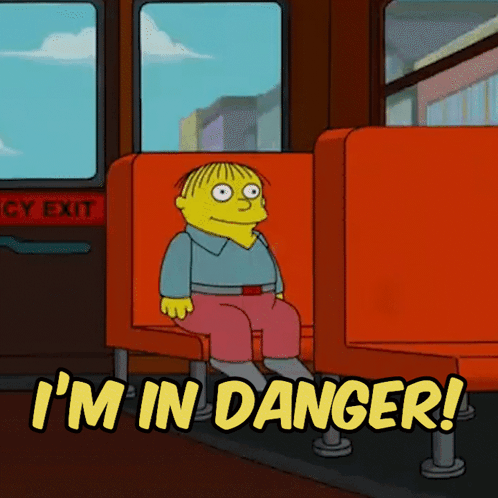 A Cartoon Character Sitting On A Bus With The Words I 'M In Danger Above Him GIF
