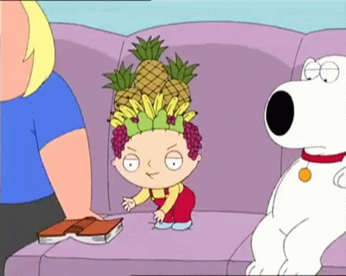 A Cartoon Character Sitting On A Couch With A Book And A Pineapple On His Head GIF