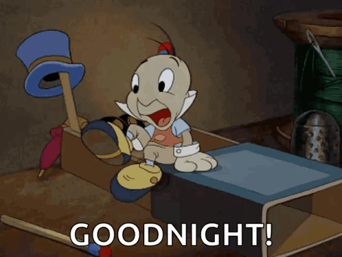A Cartoon Character Sitting On A Table With The Words " Goodnight " Below Him GIF