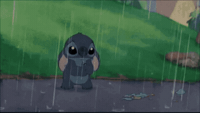 A Cartoon Character Standing In The Rain GIF