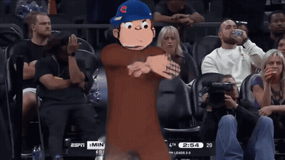 A Cartoon Character Stands In Front Of A Crowd Watching A Basketball Game Between The Chicago Cubs And The San Francisco GIF