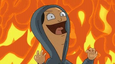 A Cartoon Character Wearing A Blue Hoodie Is Standing In Front Of A Fire Background . GIF