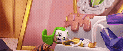 A Cartoon Character Wearing A Green Hat Is Laying On A Couch . GIF