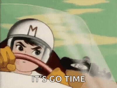 A Cartoon Character Wearing A Helmet And Gloves Is Driving A Car And Saying It 'S Go Time . GIF