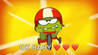 A Cartoon Character Wearing A Helmet Is Riding A Bike And The Words Ok Baby Are Above Him GIF