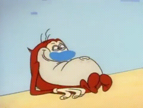 A Cartoon Character Wearing A Mask Is Laying On A Bed With A Blanket . GIF