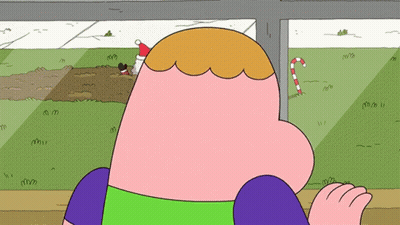 A Cartoon Character Wearing A Santa Hat And A Candy Cane GIF