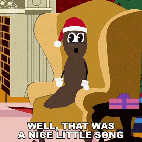 A Cartoon Character Wearing A Santa Hat Is Sitting In A Chair And Says " Well That Was A Nice Little Song " GIF