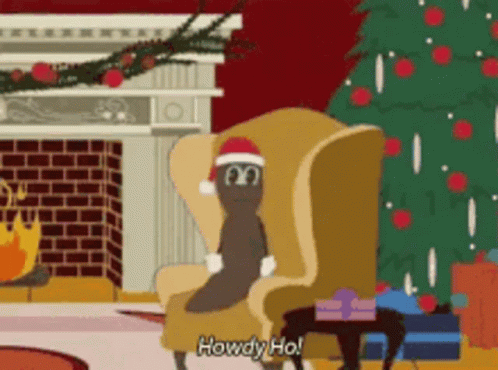 A Cartoon Character Wearing A Santa Hat Is Sitting In A Chair GIF