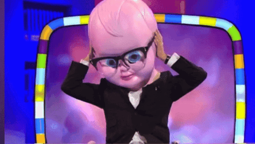 A Cartoon Character Wearing Glasses And A Suit Holds His Head GIF